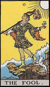 The Fool Tarot Card Upright from the Major Arcana of the classic Rider Waite Tarot deck. The Fool card depicts a young man walking towards the edge of a cliff, looking to the sky, seemingly unaware of the potential danger that awaits. He carries a bindle with a small sack over one shoulder and a white rose in his other hand, and wears a red feathered cap. He is accompanied by a small white dog. The number zero is at the top of the card. The sun, a yellow sky and ice-capped mountains form the backdrop. Explore The Tarot Guide, learn how to read Tarot and discover The Fool Tarot card meanings for Love, Relationships, Career, Money, Health, Spirituality, General, Keywords and more!